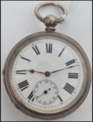 An early 20th century open faced silver pocket watch having key wind movement, enamel faced with