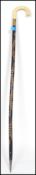 A 19th century Victorian walking stick cane having a shaped ivory handle with ebonised and carved