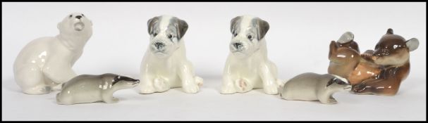 A group of six mid century made in USSR ceramic figurines to include a pair of terrier dogs a