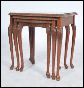 A good set of Regency revival walnut nest of tables. In burr walnut with carbriole legs with pad