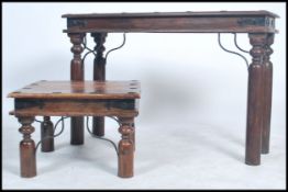 A vintage hard wood console table console tale and coffee table raised on long cylindrical legs with