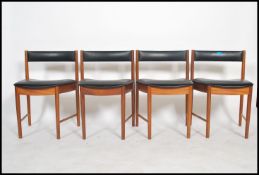 A set of four retro mid 20th century teak wood Macintosh dining chairs in the manner of Frem Rojle