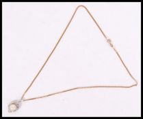 A 9ct gold and pearl ladies necklace and pendant,