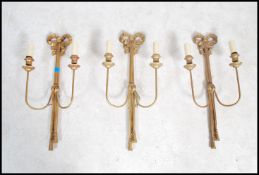 A set of 3 adams revival early 20th century gilt metal ormulu 3 branch wall sconces adorned with