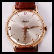 A vintage mid sized wristwatch by Titan having a 17 ruby jewel movement, baton and number numerals