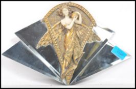 A 1930'ss art deco mirror of small odeon an form having a stepped fan back design with central