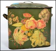 A vintage 20th century retro enamel bread bin having a green ground with floral decoration.
