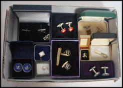 A collection of vintage gentleman's cufflinks cuff links to include Swiss, Geometcric, Anchor,