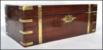 An early 19th century Georgian mahogany and brass bound campaign writing slope of large