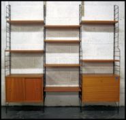 A retro 20th century Ladderax style three bay modular sectional wall system consisting of a series