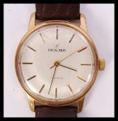 A vintage mid century Excaliber 17 jewels wristwatch having baton numerals and faceted hands set