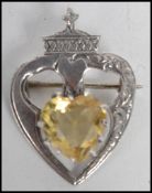 A hallmarked silver Scottish Luckenbooth brooch by Robert Allison, Edinburgh 1961 set with a heart