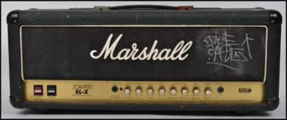 A 20th century Marshall JCM 900 SL - X amp head. Measurements: 29 cm high, 75 cm wide and 22 cm