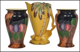 A pair of H and K Tunstall seasonal vases of tapering form with waisted and flared rims along with a