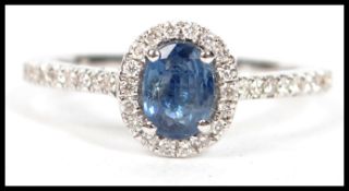 An 18ct ladies white gold and sapphire diamond ring of approx 1.1cts complete in the presentation