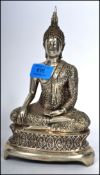 An Oriental believed 19th / early 20th century silver white metal Buddha Bodhisattva in the lotus