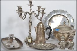 A collection of silver plated wares to include candelabra, large lidded dish with ladel, , table