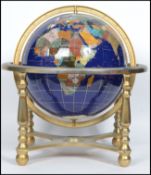 A large 20th century spherical globe having Lapis Lazuli inlay and inset semi precious stone