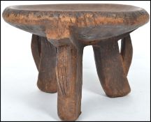 A late 19th / early 20th Century African stool, th