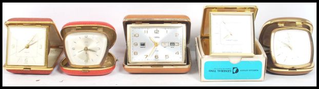 A group of five vintage retro 20th century travel clocks to include a boxed Westclox, another
