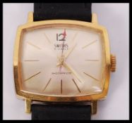 A good mid sized Smiths 21 Jewel gents wristwatch having baton numerals, faceted hands, red arrow