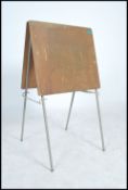 A wooden plywood point of sale A - board raised on