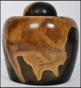 A well carved 20th century lidded ginger jar of squat form, each piece of the jar carved from a