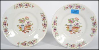 A pair of 19th century English Chinoiserie cabinet plates, each with stylised borders and central