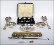 A collection of silver and silver plated items to include a hallmarked condiment spoon for Sheffield