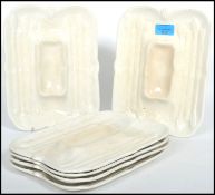 A set of six 19th century Staffordshire Asparagus serving dishes, each dish with a central recess