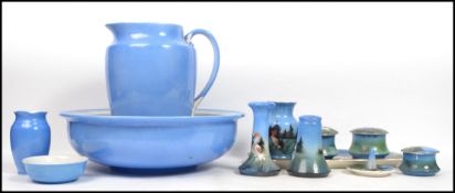 An early 20th century dressing table and washstand set depicting flamingos on a forest background