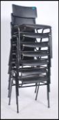 A retro vintage 20th century set of 7 stacking chairs of tubular construction with makers label
