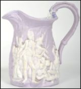 Nelson interest - A 19th century lilac ground ceramic cream jug embossed with scenes of probably the