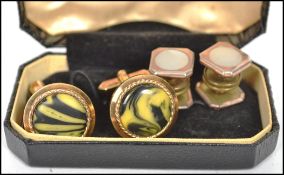 A stunning pair of vintage 20th century cuff links together with a pair of gilt metal collar studs /