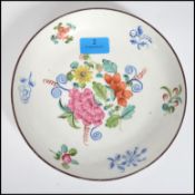 A believed early 19th century New Hall (Newhall) ceramic saucer dish with a central hand painted
