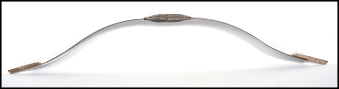 An Indian Koftgari Steel ceremonial Bow. The bow of two sections screwing together at the swollen