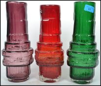 A group of three retro 20th century studio art glass Whitefriars style drunken bricklayer vases of