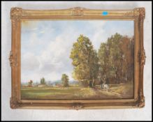 An oil on canvas landscape  painting with a hamlet to the background of a woodland scene with a