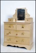 A Victorian country pine dressing table chest of drawers. The swing mirror flanked by trinket