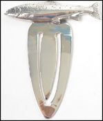 A gentlemans / ladies 20th century silver bookmark of sabre form adorned with a fish finial (