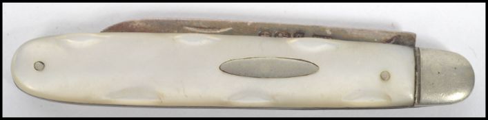 A silver hallmarked fruit knive - pen knive with mother of pearl handle being hallmarked for