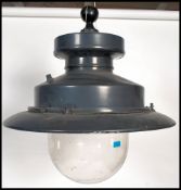 A vintage style 20th century industrial street lamp by Urbis. The cast metal pendant shade sitting