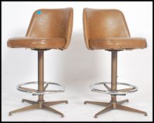 A pair of American style bar stools, in the manner