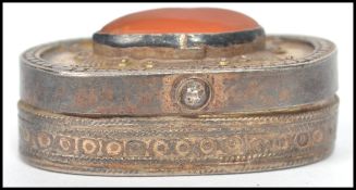 A vintage Kazakhstan silver gilt and Carnelian snuff box from Russian central Asia, fitted with a