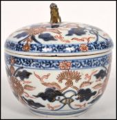 A Kang Hsi Oriental Chinese Imari jar and cover with gilt temple lion / dog of Fu finial to top with