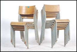 A set of eleven 1950 / 60's steel tubular stacking chairs with panel seats and backs. Measurements