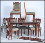 An Edwardian mahogany extending dining table with two extra leaves and winder, the rectangular top