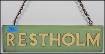 A vintage 20th century Restholm garage sign having metal chain to top with white painted letters