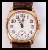 A good early 20th century 9ct gold JW Benson of London gents wristwatch having Art Deco faceted