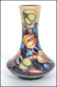 A 20th century Moorcroft tubelined baluster vase having an ovoid body with tapering neck and